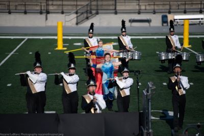 Color guard and drumline perform together. Image courtesy of Nazaire LeBlanc.