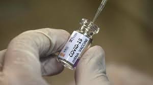 A small bottle of a COVID-19 vaccine.(Image Credit: Sakchai Lalit / Associated Press) (Courtesy of the LA Times)